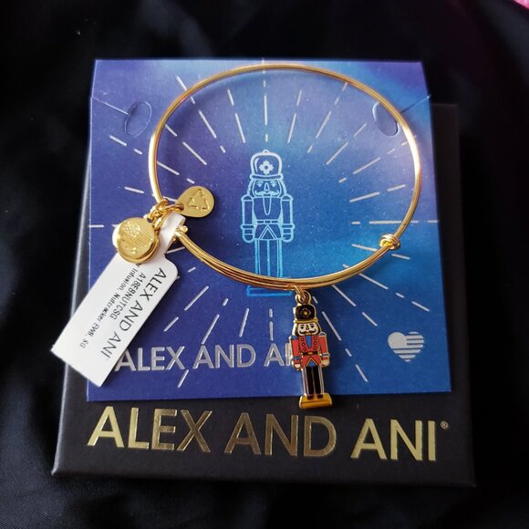 NWT Alex and Ani nutcracker Charm Gold Bangle Comes with Box & Card - Picture 4 of 4